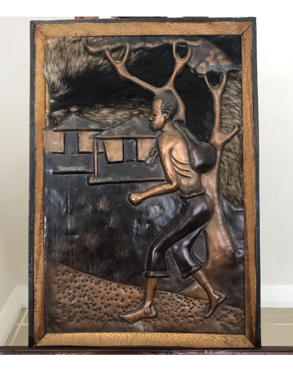 African Man Walking to Work In Copper Frame