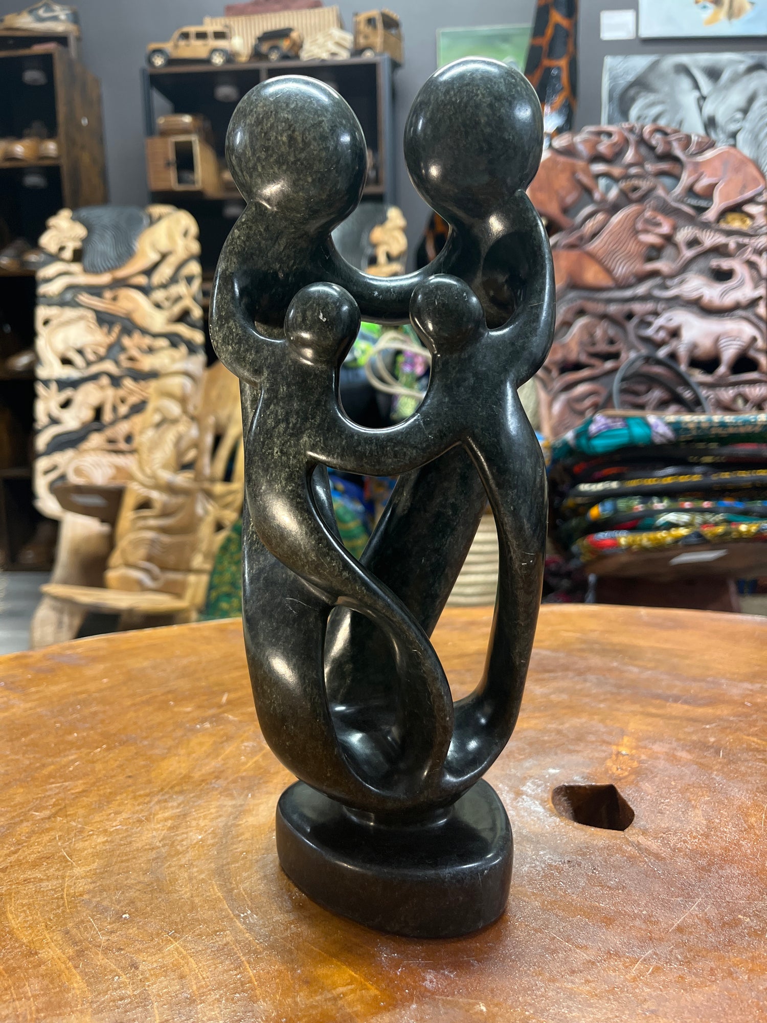 Hand Carved Stunning Green Stone Abstract Sculpture - Parents and Two Children (Dark - Wide)