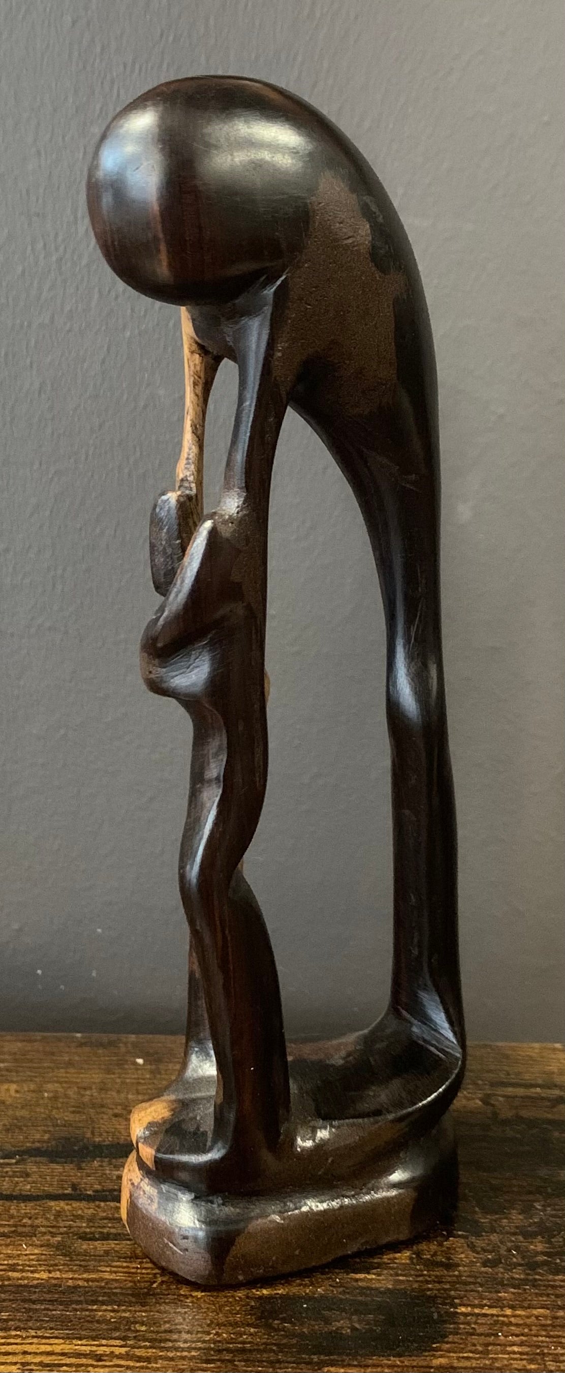 Wooden Mother Breaking Up a Fight Between Siblings