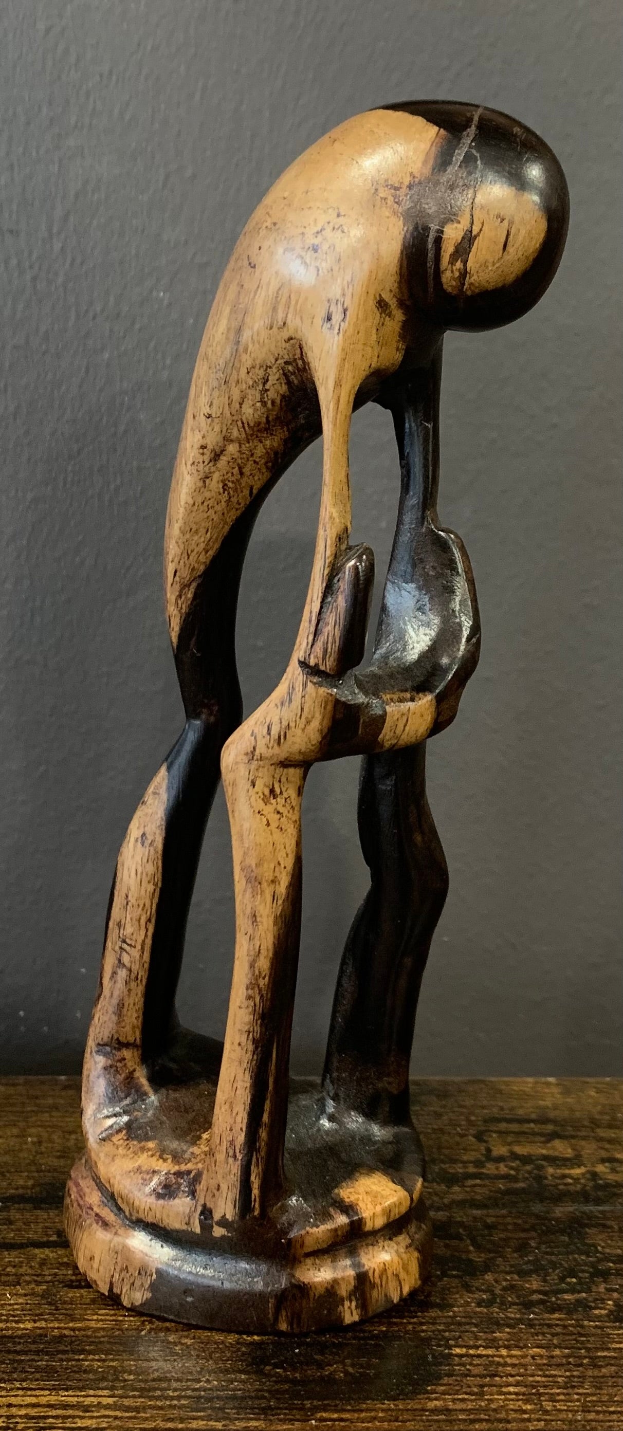 Wooden Mother Breaking Up a Fight Between Siblings