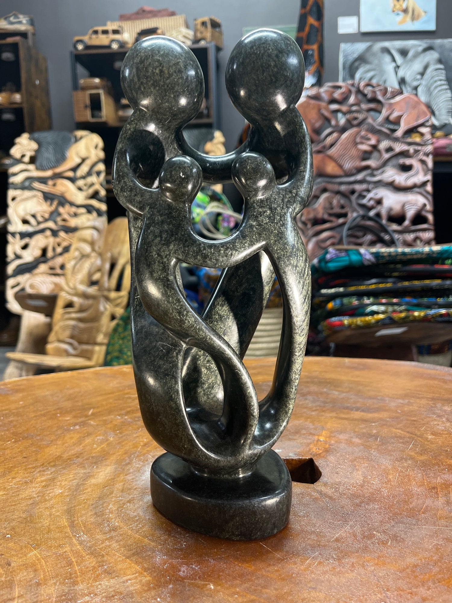 Hand Carved Stunning Green Stone Abstract Sculpture - Parents and Two Children (Dark - Wide)