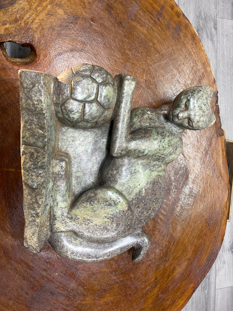 Green Stone Panther Playing with a Football