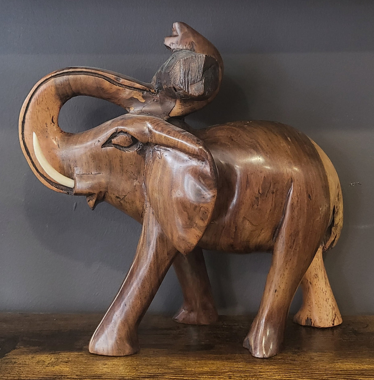 Mahogany Elephant Holding Tree Log from Trunk