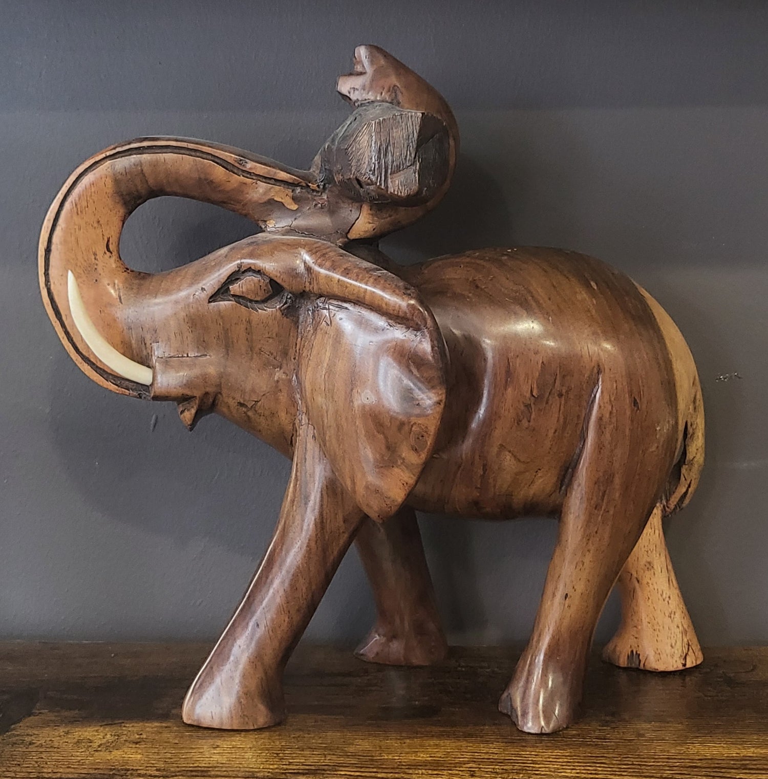 Mahogany Elephant Holding Tree Log from Trunk