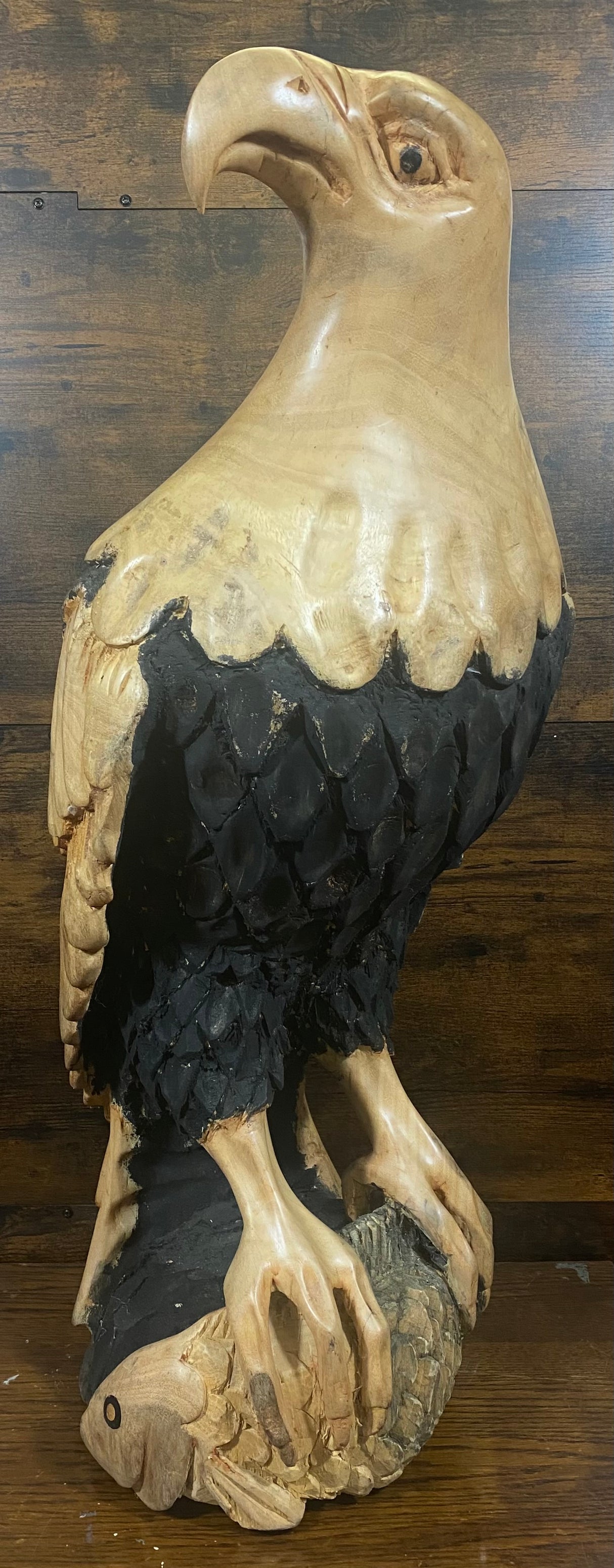 Beautifully Carved Bald Eagle Perched on Stone with a Trapped Fish