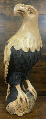 Beautifully Carved Bald Eagle Perched on Stone with a Trapped Fish