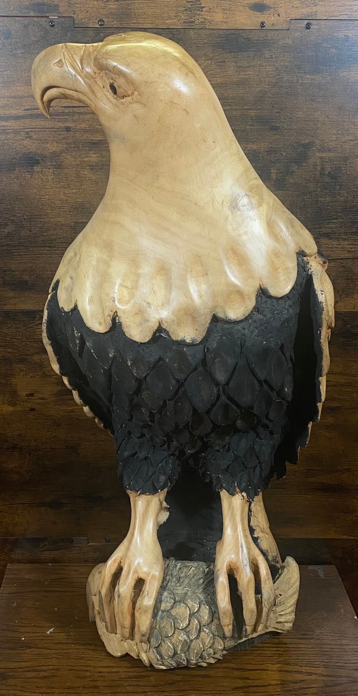 Beautifully Carved Bald Eagle Perched on Stone with a Trapped Fish