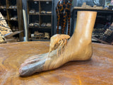 Carved Sculpture of a Mosquito Biting on a Foot