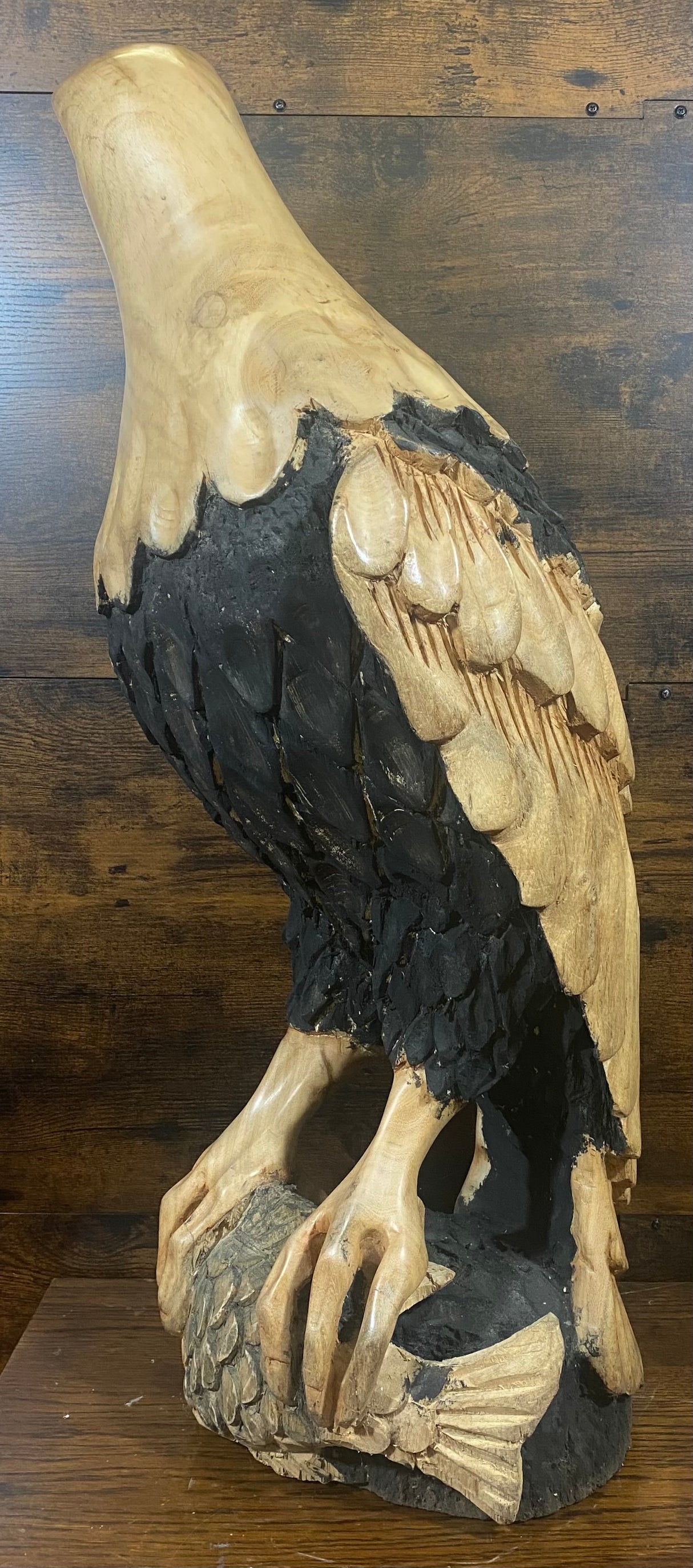 Beautifully Carved Bald Eagle Perched on Stone with a Trapped Fish