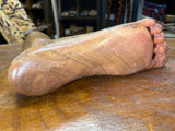 Carved Sculpture of a Mosquito Biting on a Foot