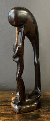 Wooden Mother Breaking Up a Fight Between Siblings