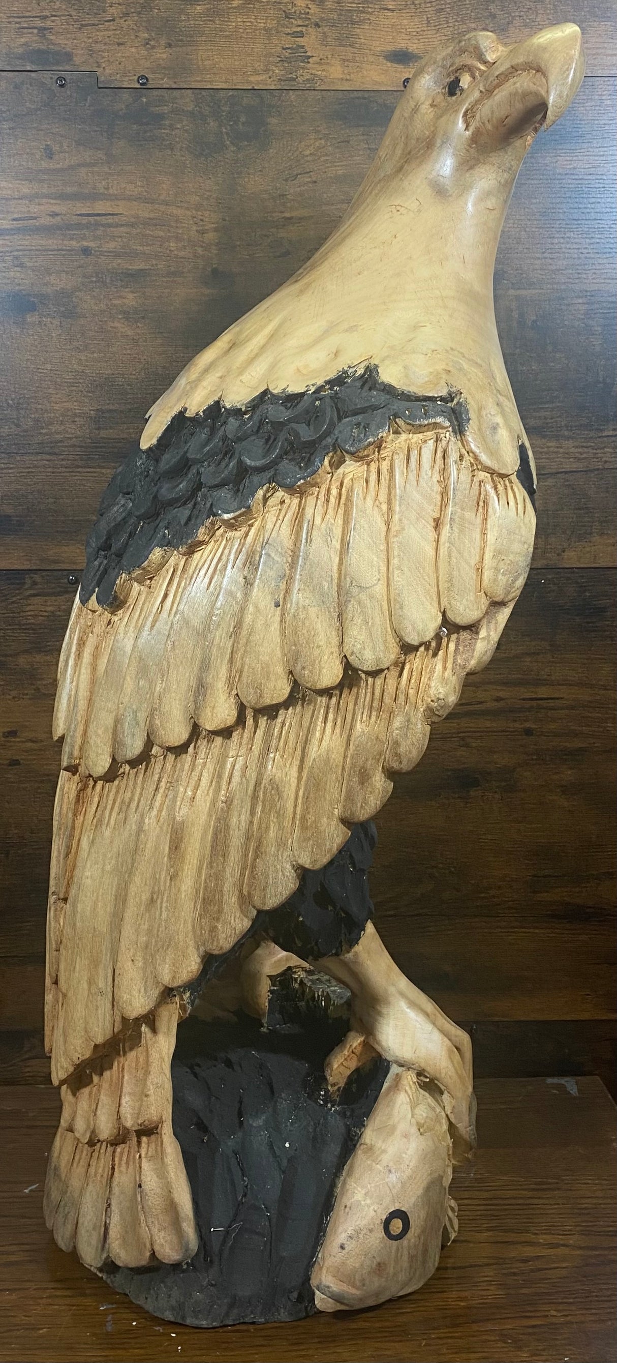 Beautifully Carved Bald Eagle Perched on Stone with a Trapped Fish