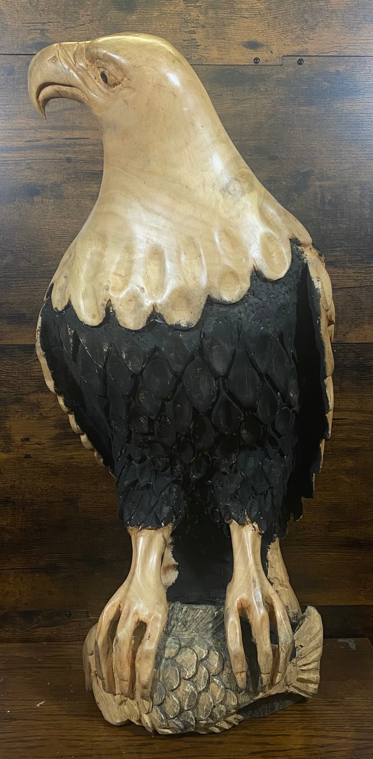 Beautifully Carved Bald Eagle Perched on Stone with a Trapped Fish