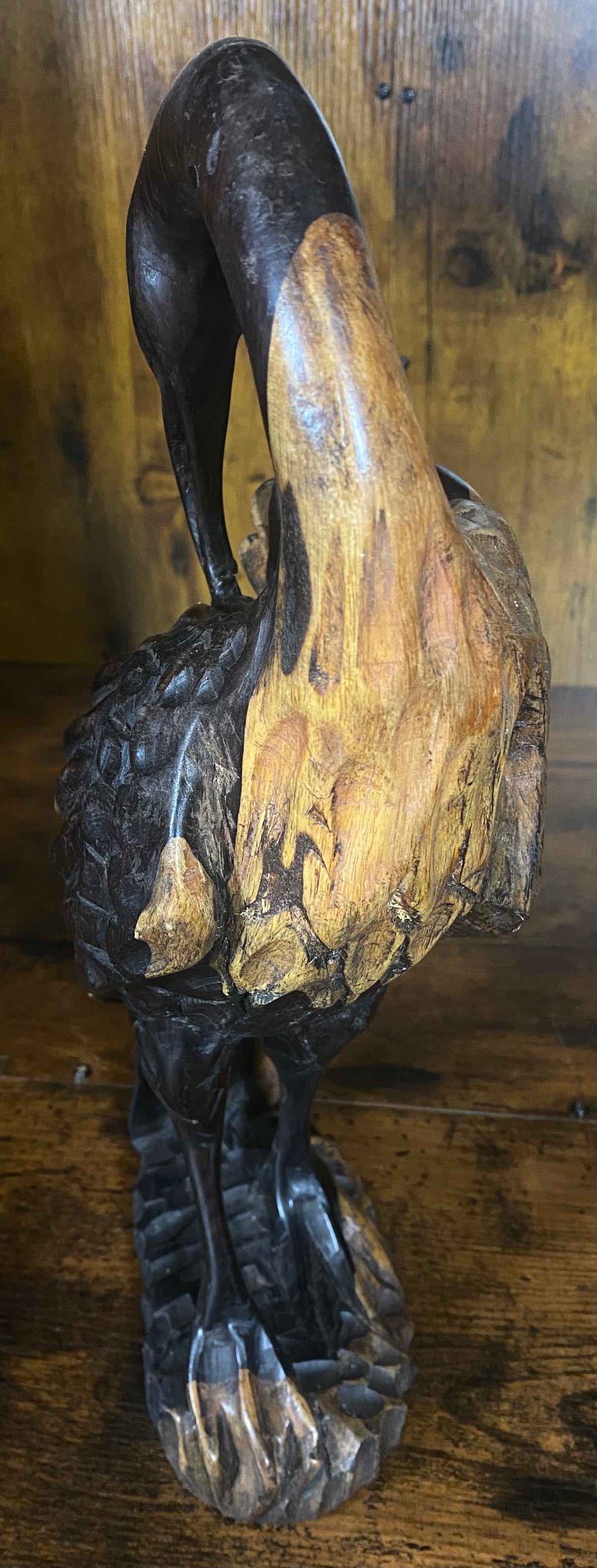 Hand Carved Stressed Bird Plucking Feathers from its Back