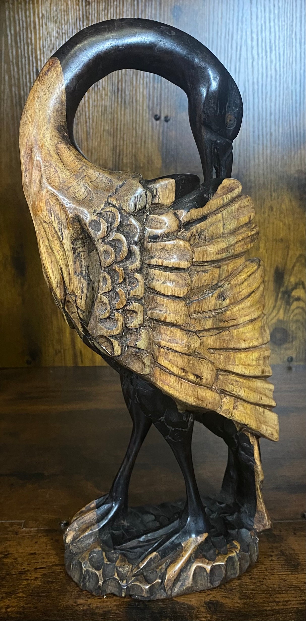 Hand Carved Stressed Bird Plucking Feathers from its Back