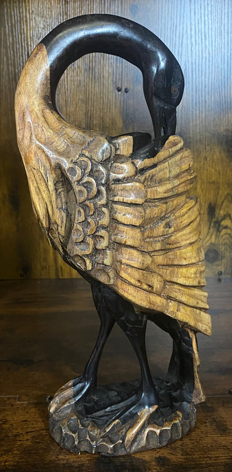 Hand Carved Stressed Bird Plucking Feathers from its Back