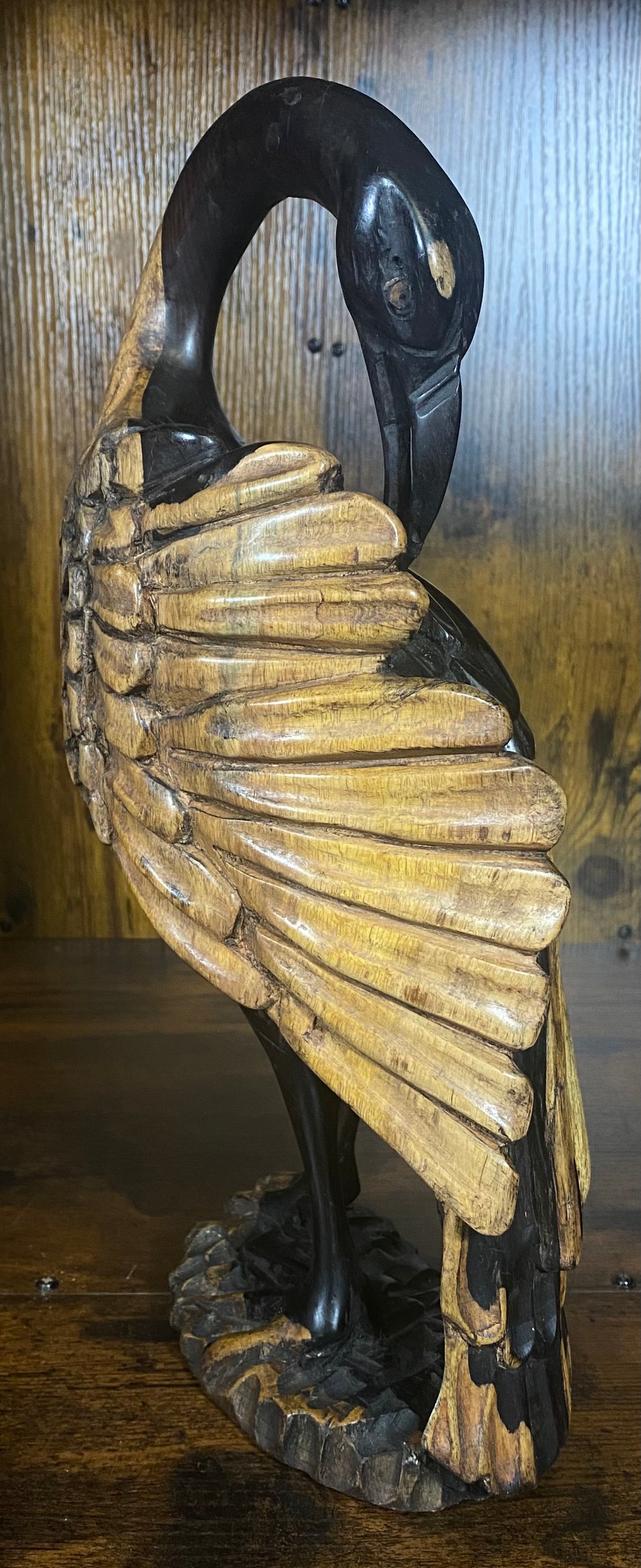 Hand Carved Stressed Bird Plucking Feathers from its Back