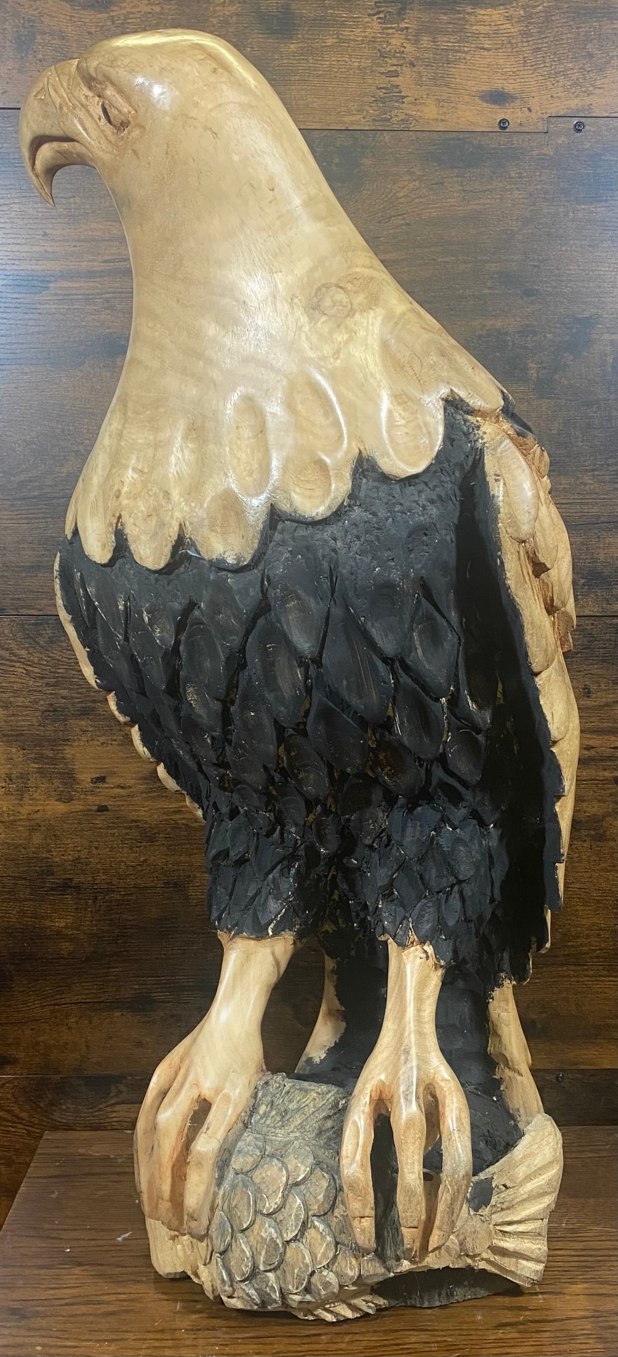 Beautifully Carved Bald Eagle Perched on Stone with a Trapped Fish