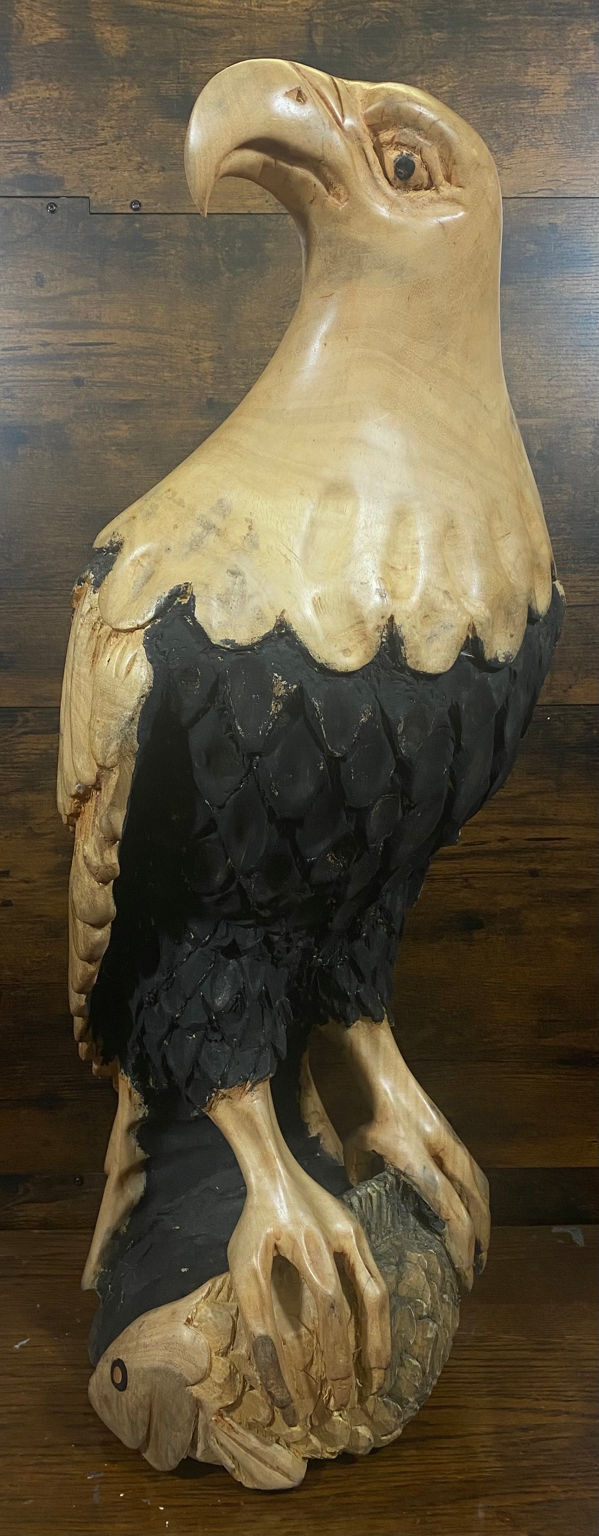 Beautifully Carved Bald Eagle Perched on Stone with a Trapped Fish